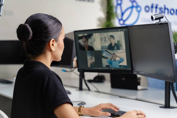 An Offshored team member on a video call with an Australian client