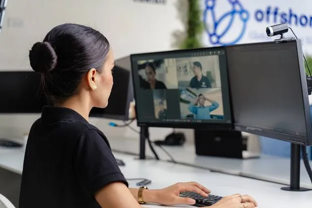 An Offshored team member on a video call with an Australian client