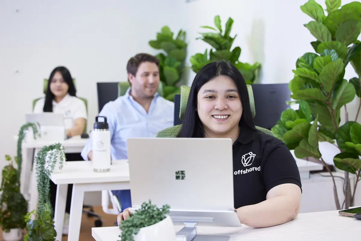 Offshored team members at work in the York Street office, Sydney